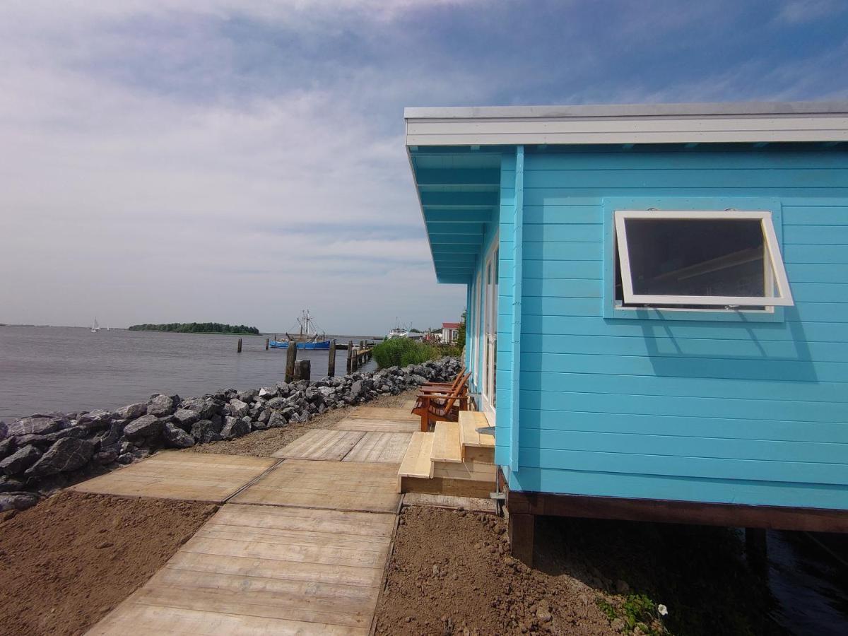 Waterhuisjes Op De Pier Van Lauwersmeerplezier! Lauwersoog Zewnętrze zdjęcie